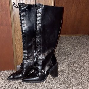 Size 8M knee high, pointed toe Charles Davis black leather boots.